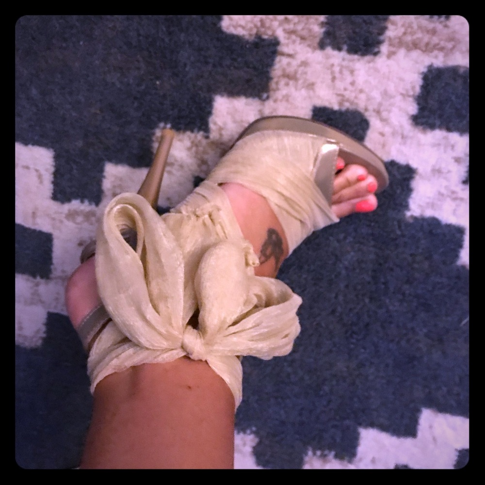Tie up red bottom shoes